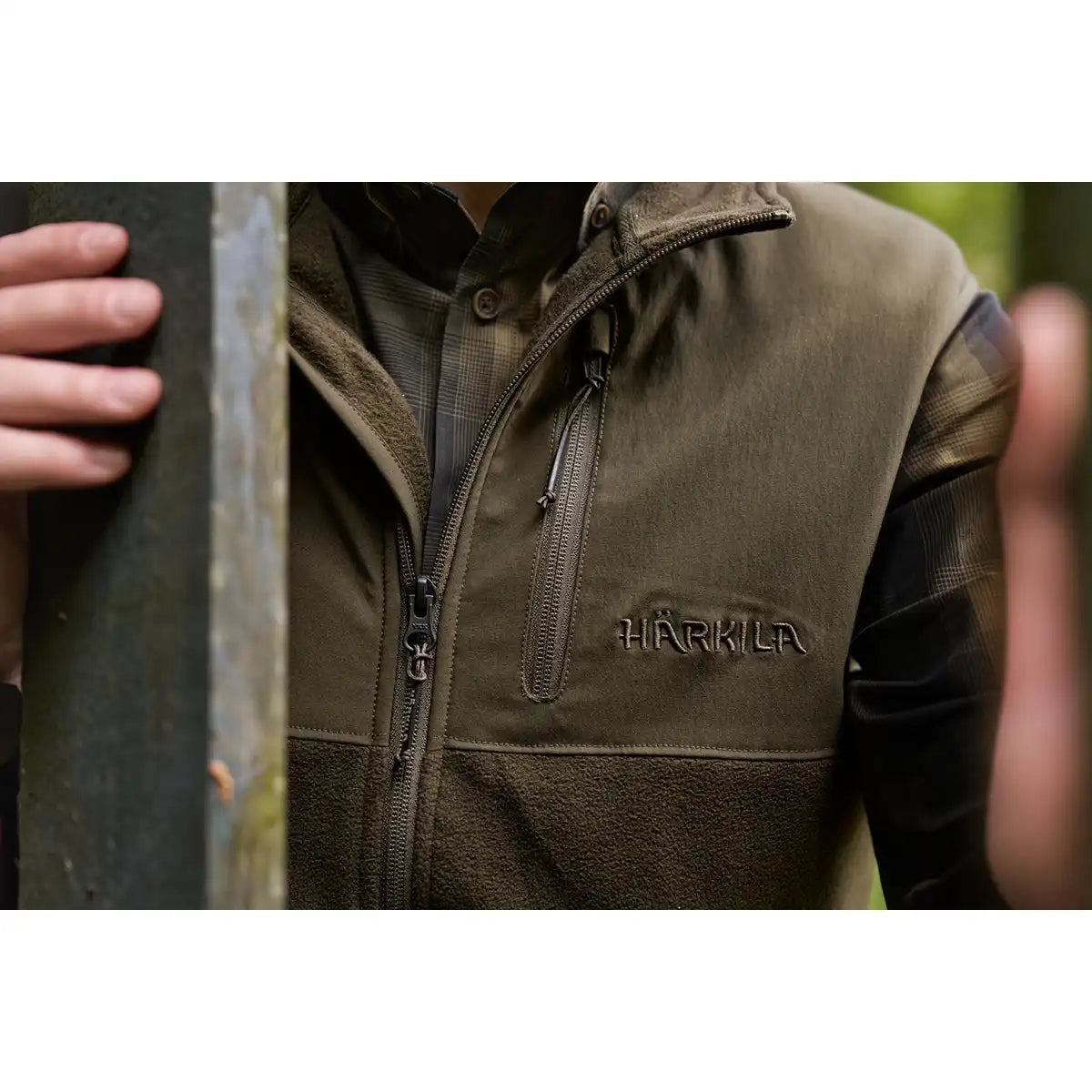 Härkila Fjell Fleece Waistcoat - Worn by Model - Front Logo Close Up Härkila Fjell Fleece Waistcoat - Worn by Model - Front Logo Close Up