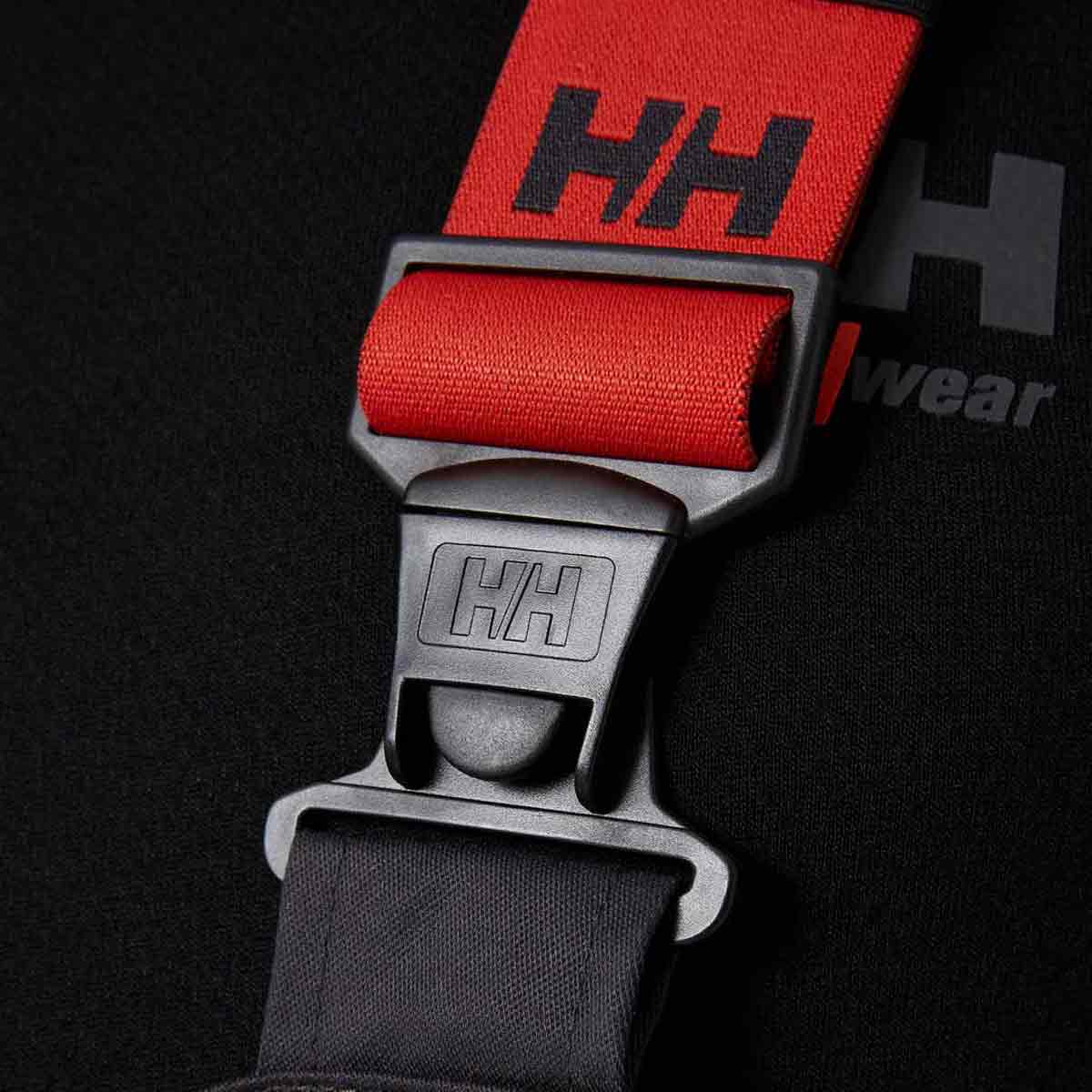 Helly Hansen Alna 2.0 Hi Vis Construction Bib Clasp Close Up Helly Hansen Alna 2.0 Hi Vis Construction Bib Clasp Close Up