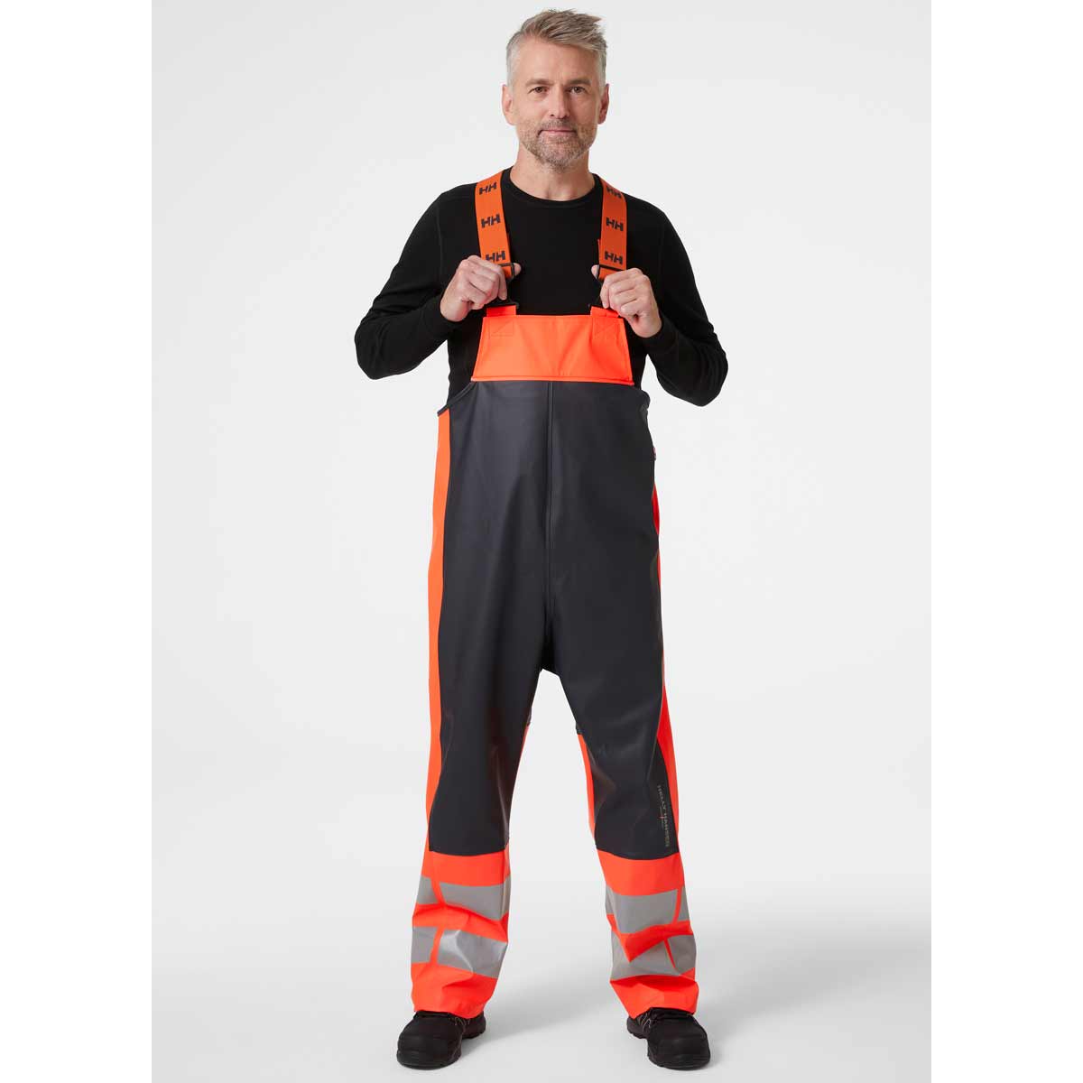Helly-Hansen-Alna-2.0-Hi-Vis-Rain-Bib-Red-FRont-onbody Helly-Hansen-Alna-2.0-Hi-Vis-Rain-Bib-Red-FRont-onbody