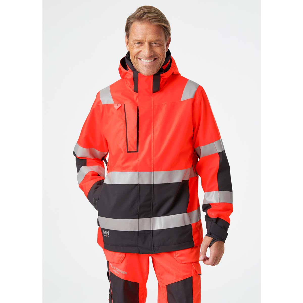 Helly Hansen Alna 2.0 Hi Vis Shell Jacket - red on model Helly Hansen Alna 2.0 Hi Vis Shell Jacket - red on model