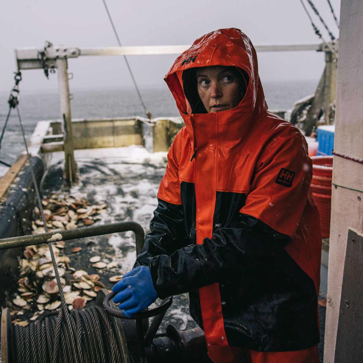 Helly-Hansen-Storm-Waterproof-Rain-Bib-Black-Lifestyle-Orange Helly-Hansen-Storm-Waterproof-Rain-Bib-Black-Lifestyle-Orange