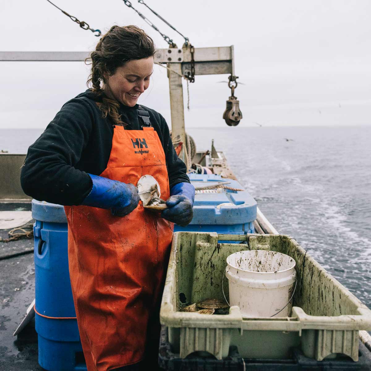 Helly-Hansen-Storm-Waterproof-Rain-Bib-Orange--Black-Lifestyle Helly-Hansen-Storm-Waterproof-Rain-Bib-Orange--Black-Lifestyle