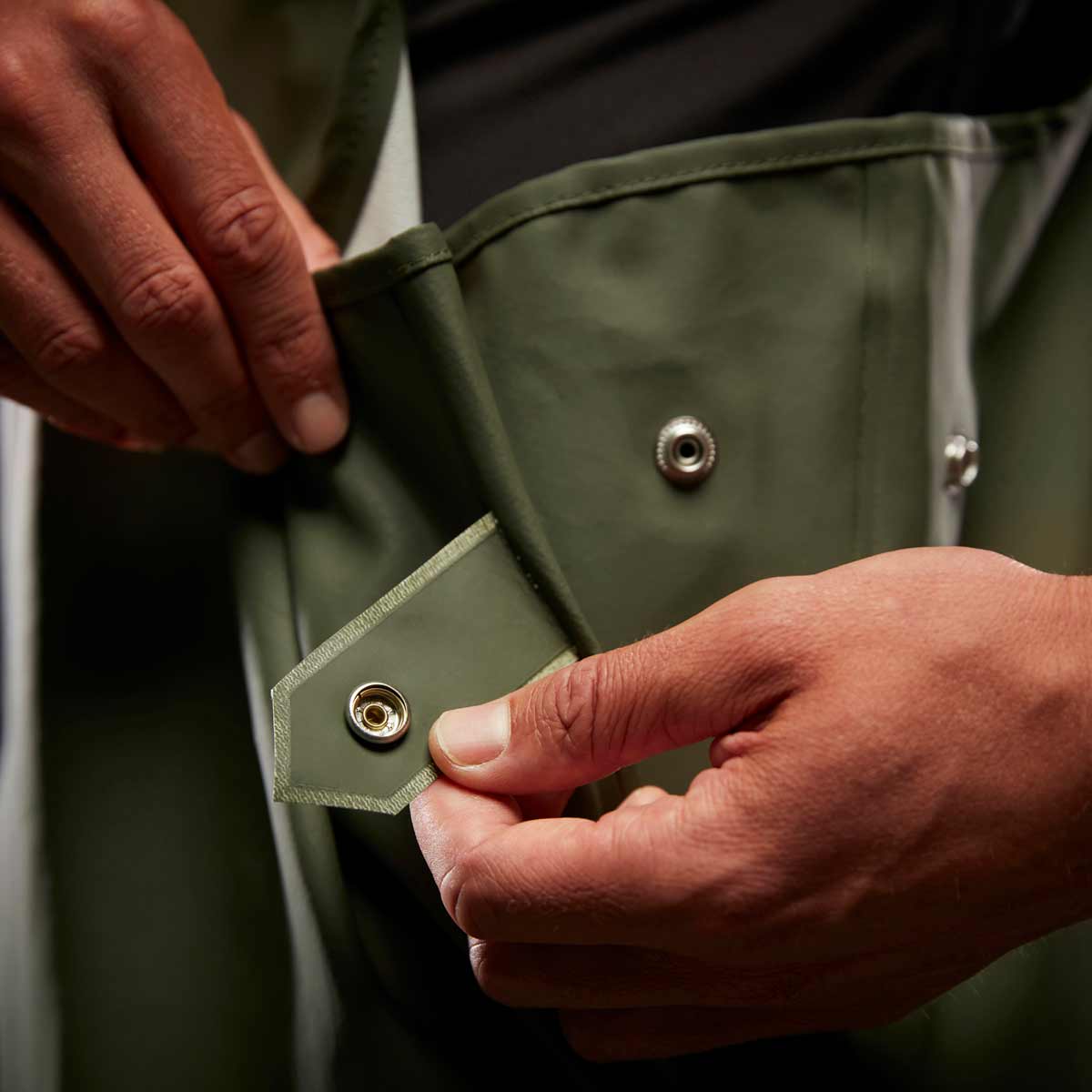 Helly-Hansen-Storm-Waterproof-Rain-Bib-greenclose-up Helly-Hansen-Storm-Waterproof-Rain-Bib-greenclose-up