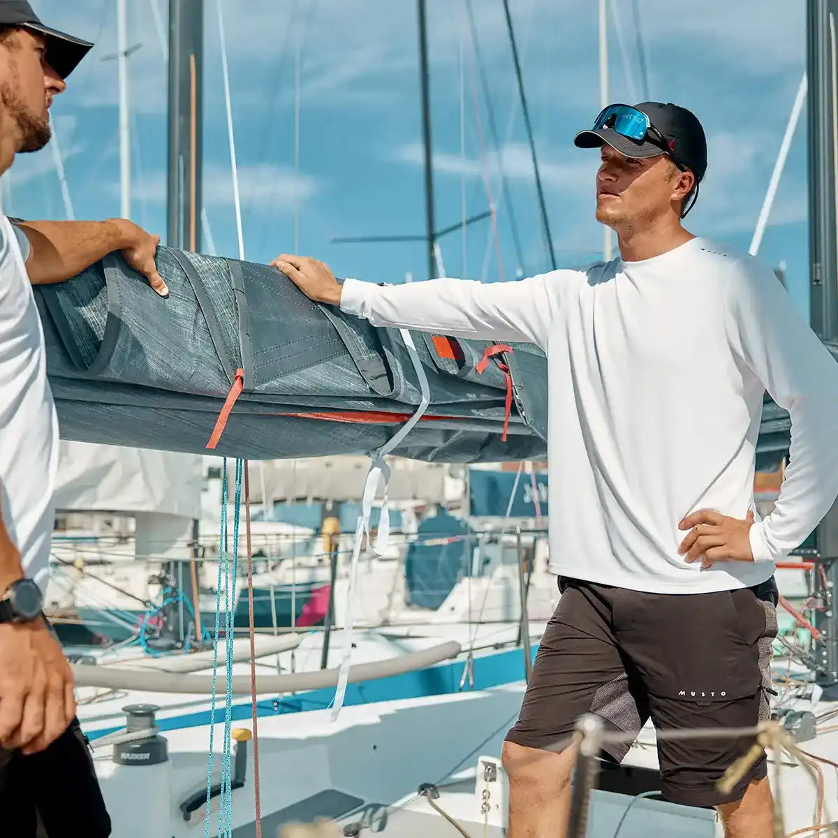 Musto Men's Evo Crew Sunblock Long Sleeve Tee- White- Lifestyle model Musto Men's Evo Crew Sunblock Long Sleeve Tee- White- Lifestyle model