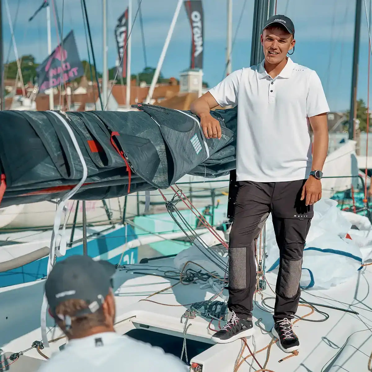 Musto Men's Evo Crew Sunblock Short-Sleeve Polo Shirt- White- on model Musto Men's Evo Crew Sunblock Short-Sleeve Polo Shirt- White- on model