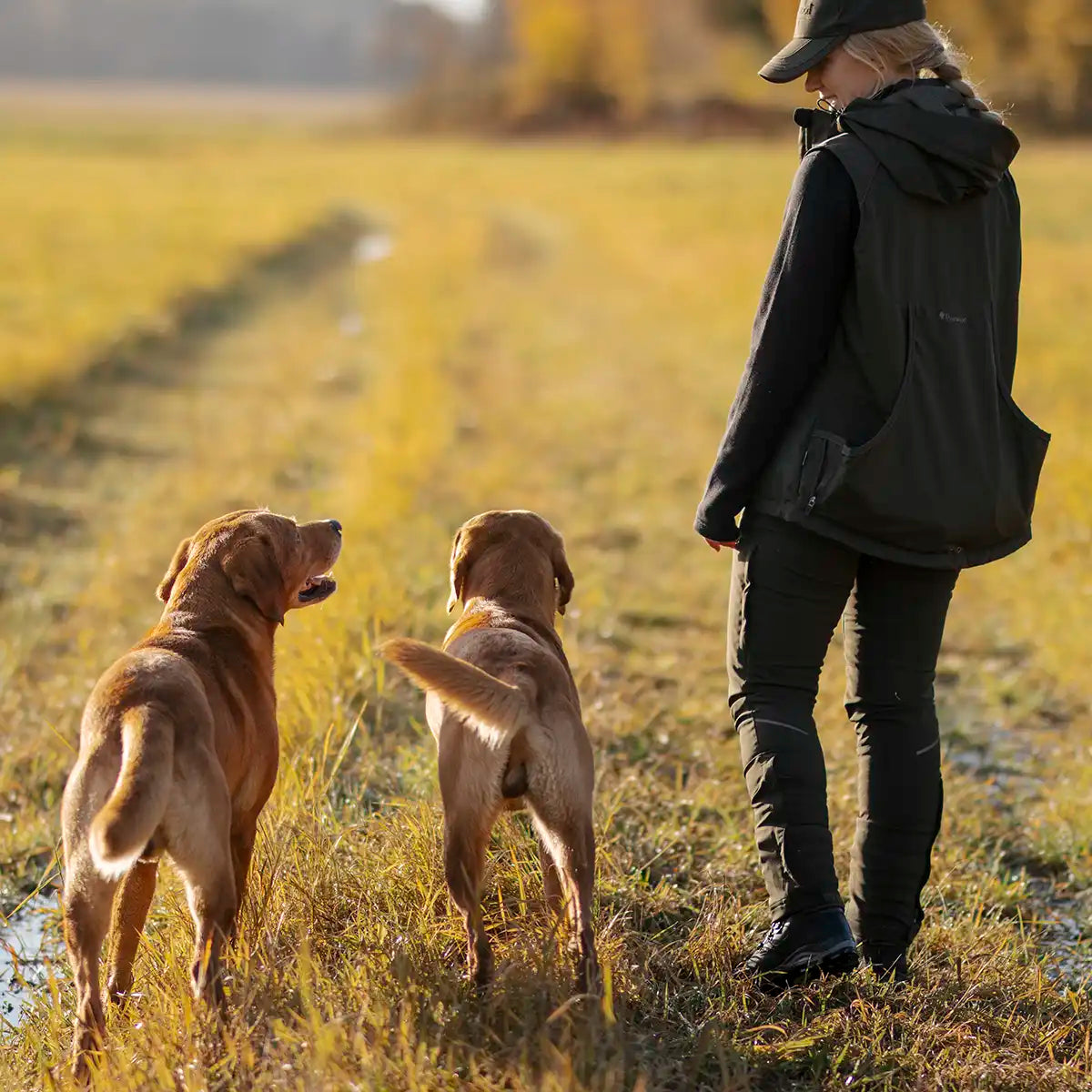 Pinewood Dog Sports 2.0 Womens Vest- dog walking lifestyle model Pinewood Dog Sports 2.0 Womens Vest- dog walking lifestyle model