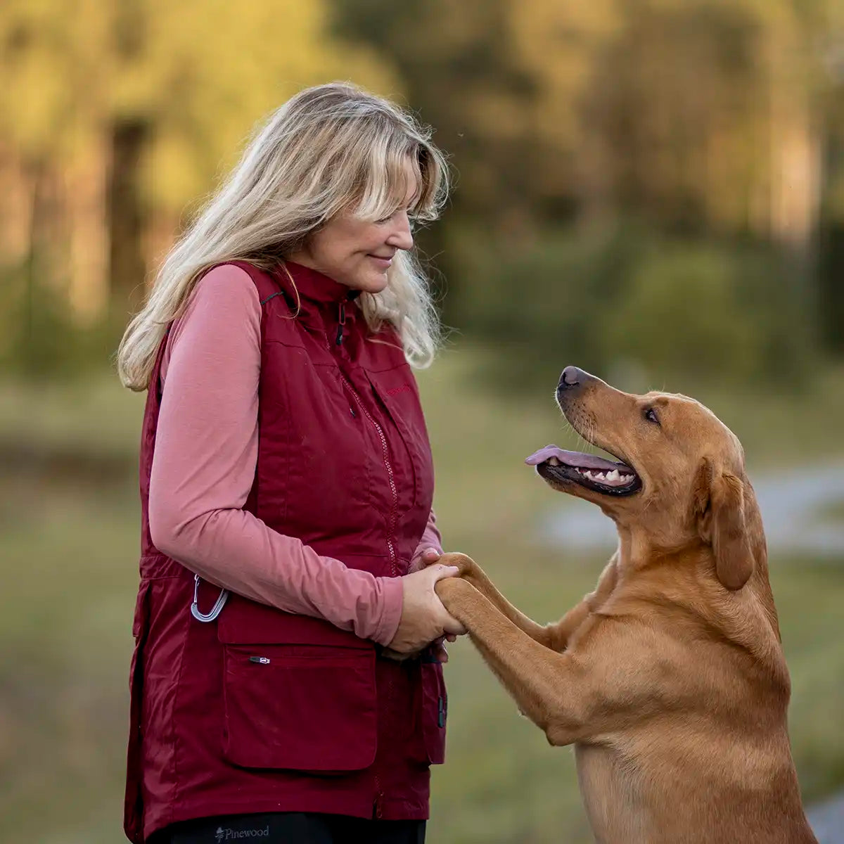 Pinewood Dog Sports Womens Trainer Vest- Dark Tomato/Dark Red- lifestyle side view Pinewood Dog Sports Womens Trainer Vest- Dark Tomato/Dark Red- lifestyle side view
