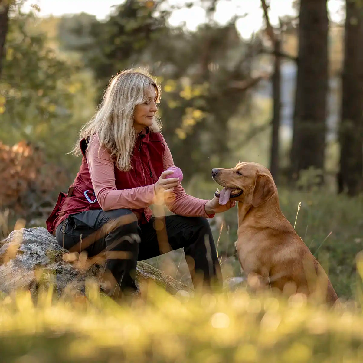 Pinewood InsectSafe Women's Function Hoodie- Brick Pink- lifestyle- dog walking Pinewood InsectSafe Women's Function Hoodie- Brick Pink- lifestyle- dog walking