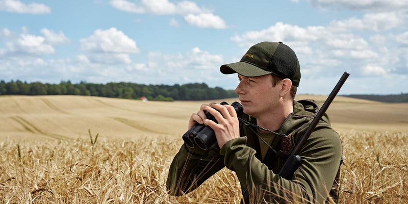 Stalker crouching low in soft-shell jacket