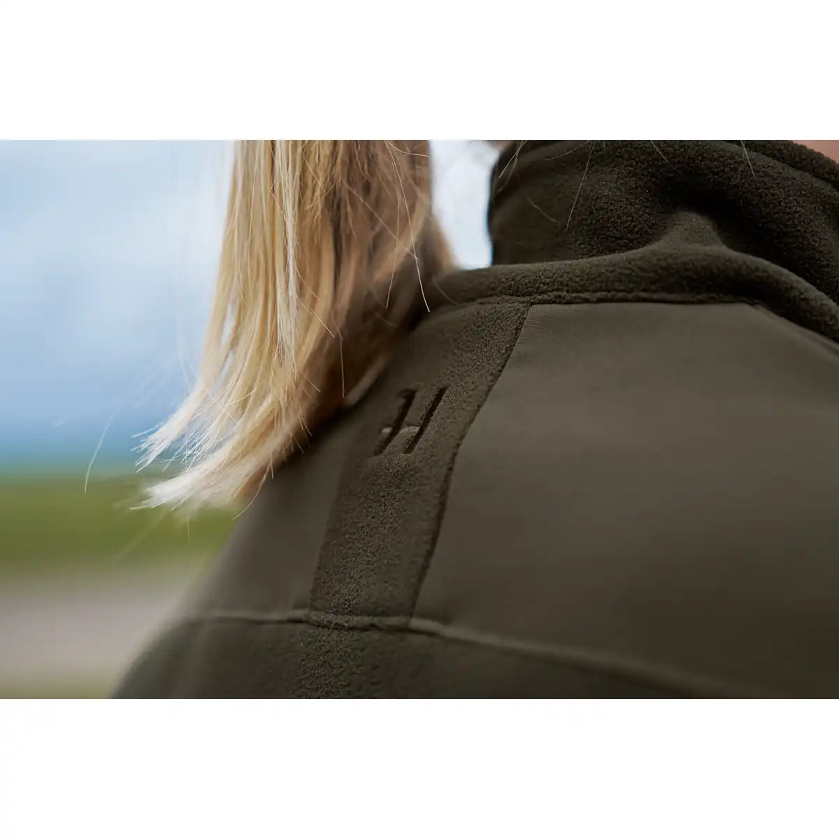 Härkila Fjell Women's Fleece Jacket - orn by Model - Back Logo Close Up